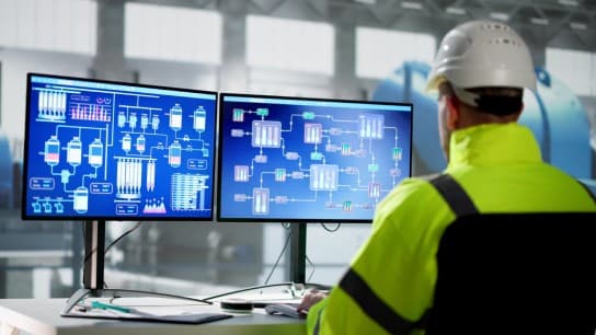 SCADA system and man at desk